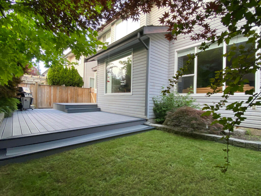 Walnut Grove Home for Sale back yard lawn and deck facing east