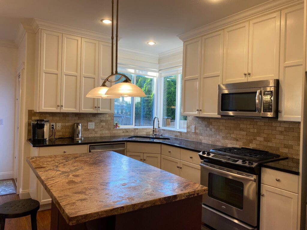 Kitchen facing north showing countertops, cupboards and island