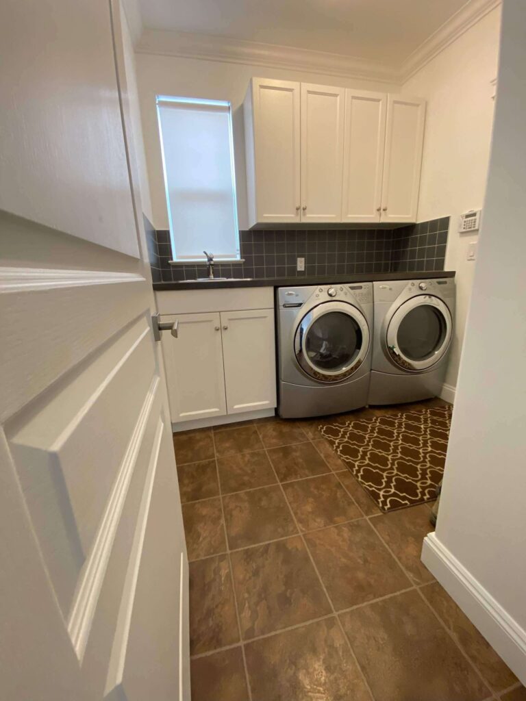 Laundry room with appliances and sink on east wall