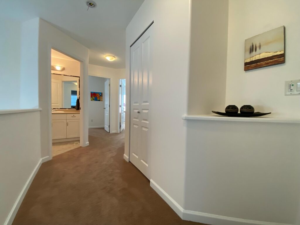 Upper hallway looking into bath and bedroom doorways