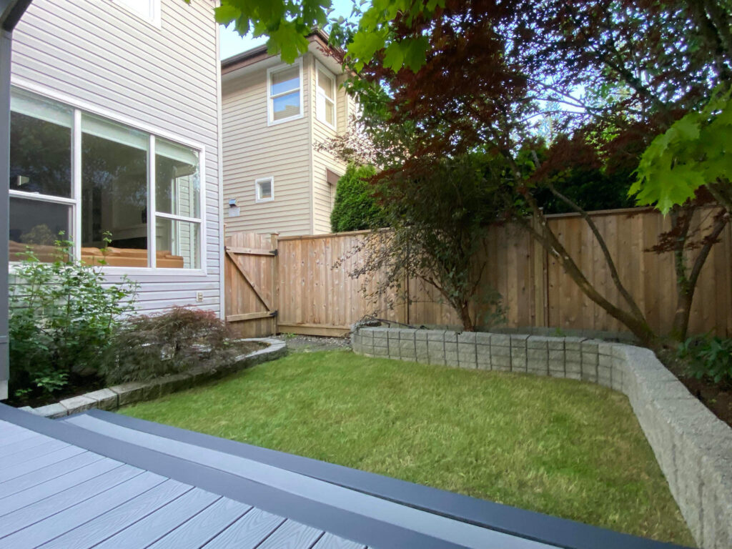 Walnut Grove Home for Sale back yard lawn and deck facing west