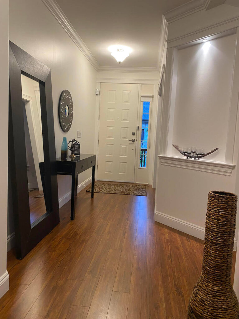 Walnut Grove home interior hallway to front door